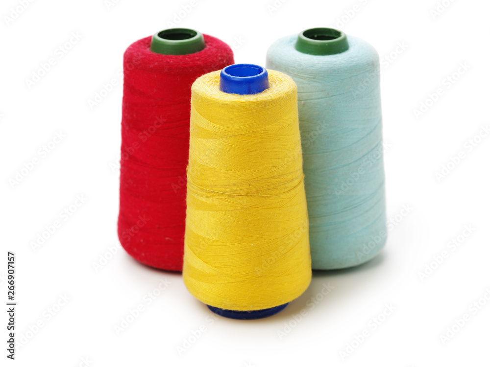 spools of thread for the textile industry on white background spools of thread for the textile industry on white background