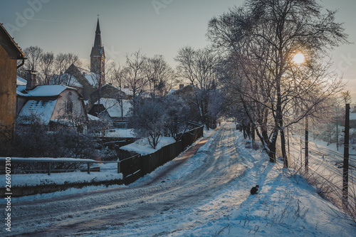 View of streets in the area of the city with the old buildings. Winter cityscape with sunset.Tornakalns district, Riga. Latvia. photo