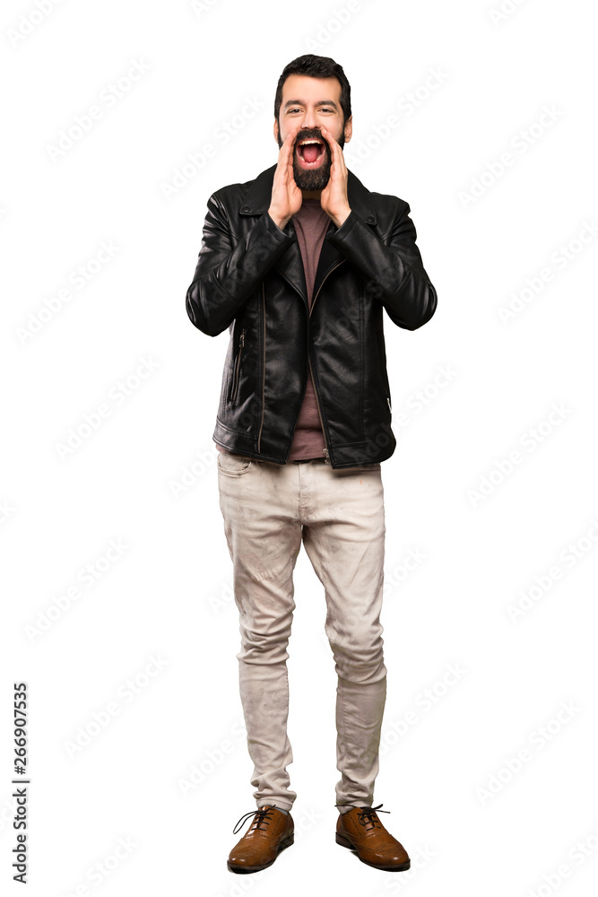 Handsome man with beard shouting and announcing something over isolated white background Handsome man with beard shouting and announcing something over isolated white background