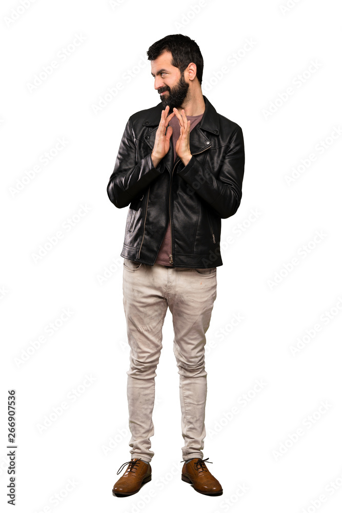 Handsome man with beard scheming something over isolated white background Handsome man with beard scheming something over isolated white background