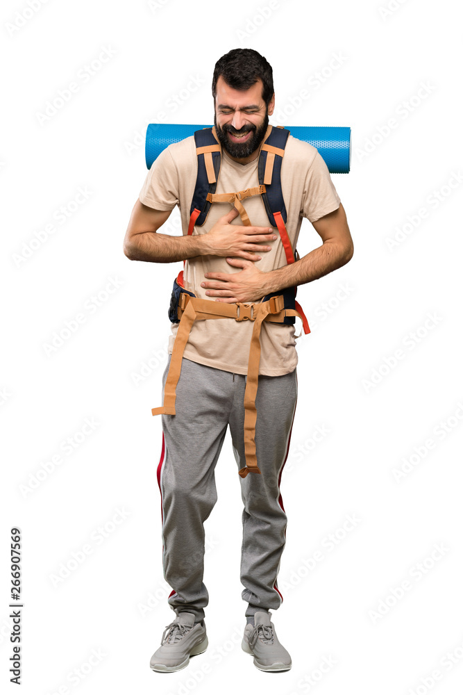 Hiker man smiling a lot over isolated white background Hiker man smiling a lot over isolated white background
