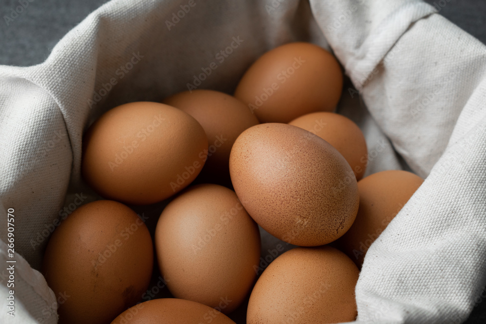 Chicken egg in bag on the concrete table background. Chicken egg in bag on the concrete table background.