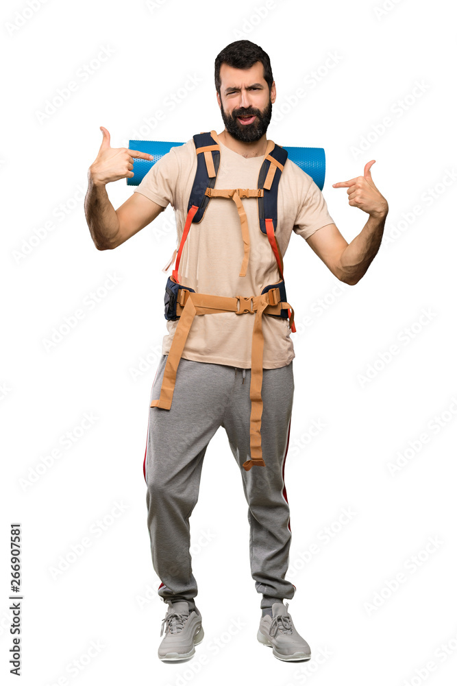 Hiker man proud and self-satisfied over isolated white background Hiker man proud and self-satisfied over isolated white background