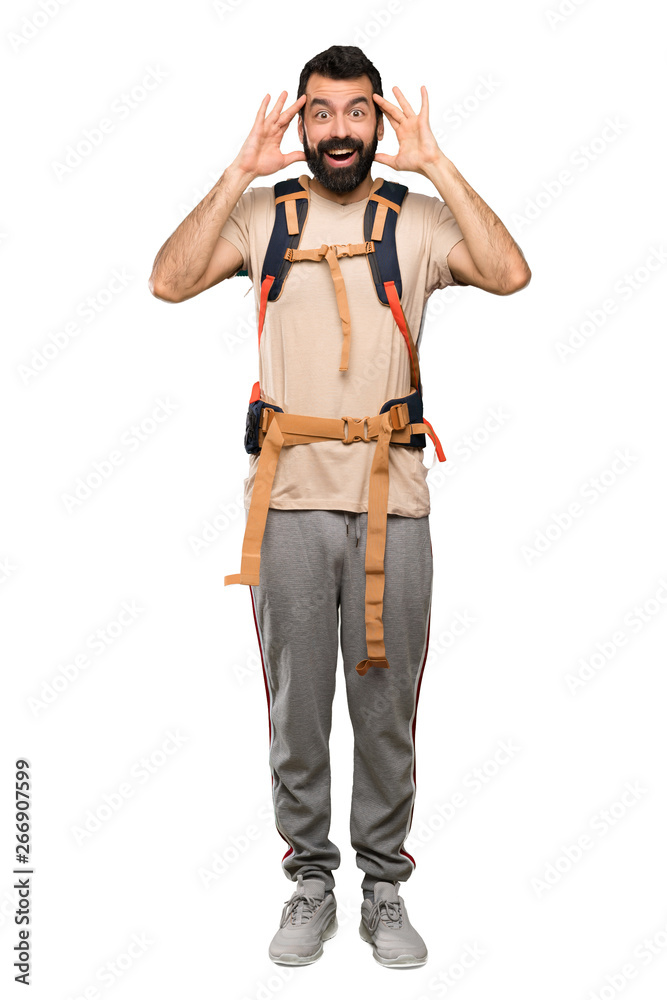 Hiker man with surprise expression over isolated white background Hiker man with surprise expression over isolated white background