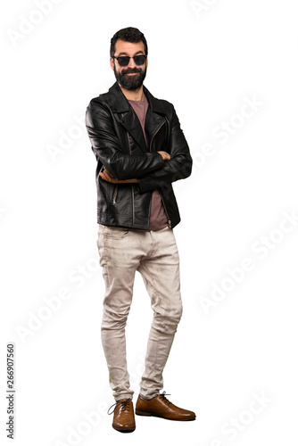 Handsome man with beard with glasses and happy over isolated white background