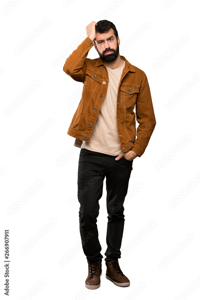Handsome man with beard with an expression of frustration and not understanding over isolated white background Handsome man with beard with an expression of frustration and not understanding over isolated white background
