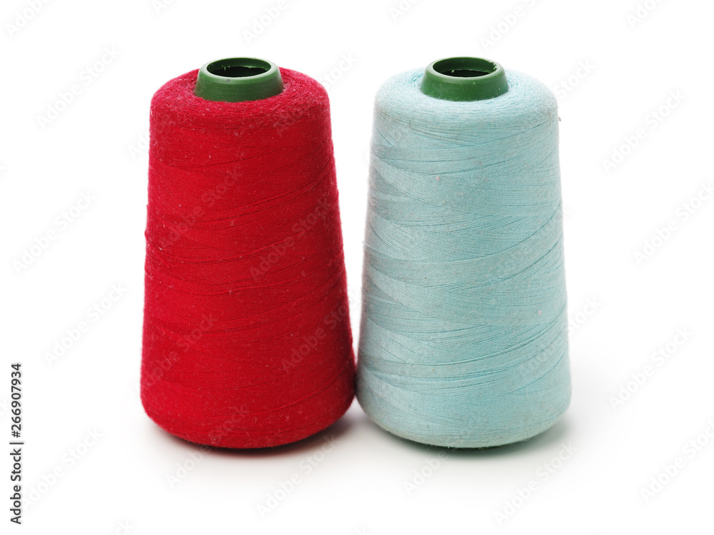 spools of thread for the textile industry on white background spools of thread for the textile industry on white background
