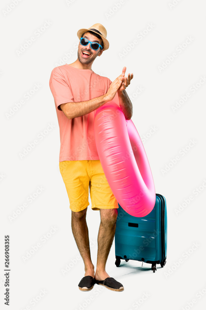 A full-length shot of Man with hat and sunglasses on his summer A full-length shot of Man with hat and sunglasses on his summer