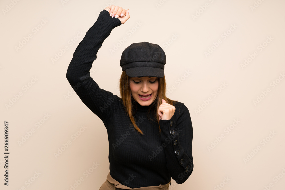 Fashion woman with hat celebrating a victory Fashion woman with hat celebrating a victory