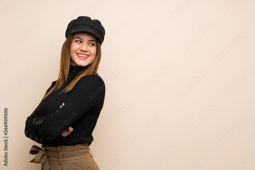 Fashion woman with hat with arms crossed and happy Fashion woman with hat with arms crossed and happy