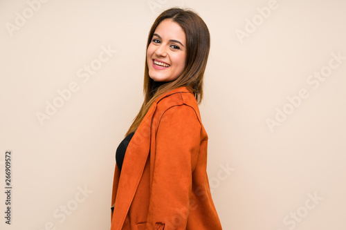 Young woman with coat laughing © luismolinero