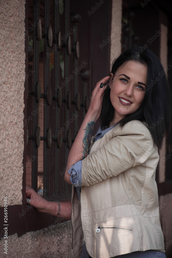 Portrait of a beautiful white young brunette woman in the sity
