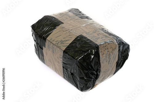 Isolated parcel wrapped with black stretch foil