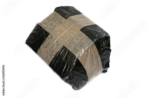 Isolated parcel wrapped with black stretch foil