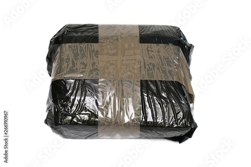 Isolated parcel wrapped with black stretch foil