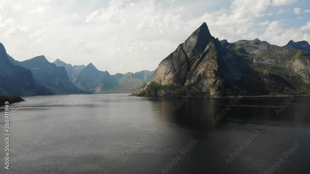 Scenic fjord landscape above the arctic circle, coast nature with sharp mountain peaks, Lofoten islands North Norway Scenic fjord landscape above the arctic circle, coast nature with sharp mountain peaks, Lofoten islands North Norway