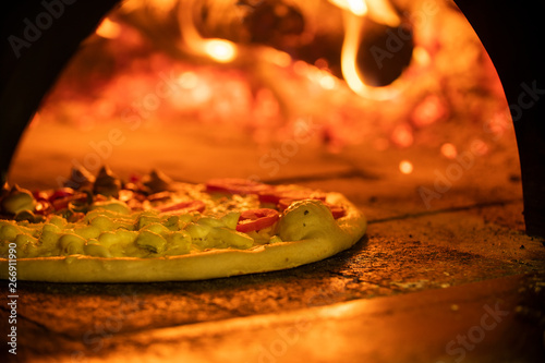 Italian pizza inside a wood oven