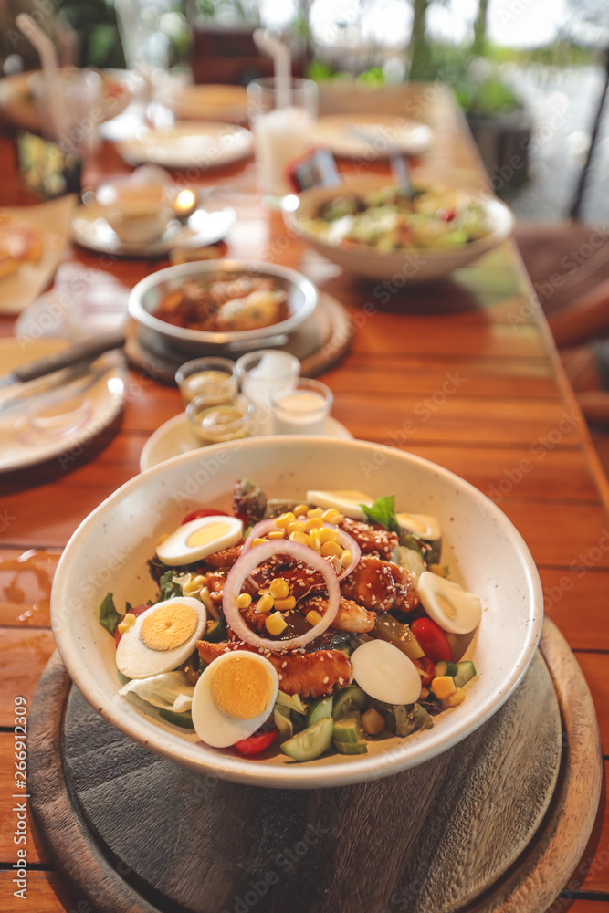 Slicing the hard-boiled eggs on salad, healthy food, Nutrition concept Slicing the hard-boiled eggs on salad, healthy food, Nutrition concept