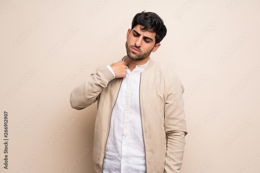 Young man over isolated wall with tired and sick expression Young man over isolated wall with tired and sick expression