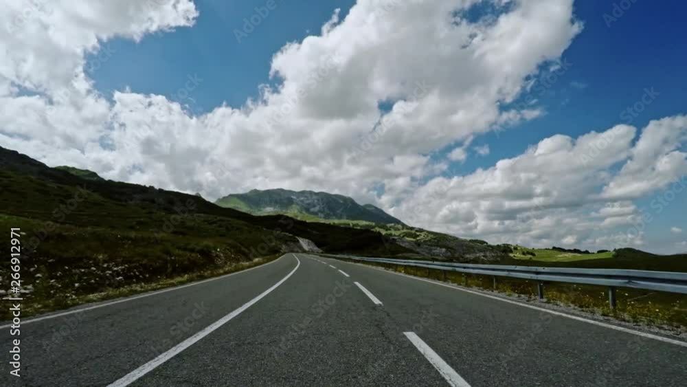 First person POV driving on a mountain pass First person POV driving on a mountain pass