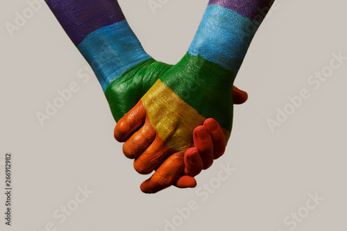 hands patterned with the rainbow flag photo