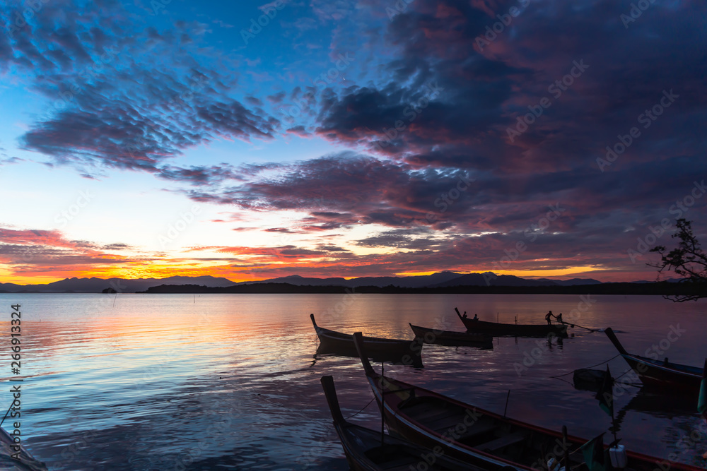 Colorful of fishing boat in the sea at sunrise Colorful of fishing boat in the sea at sunrise