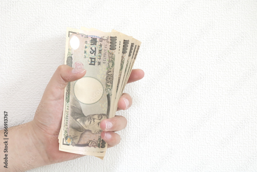 日本のお札を握る男の手 Stock Photo Adobe Stock