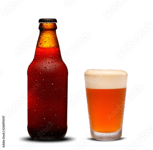 300ml beer bottles and glass beer with drops on white background.