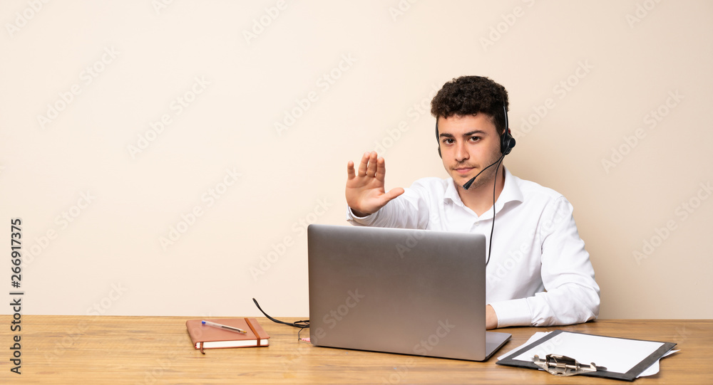 Telemarketer man making stop gesture Telemarketer man making stop gesture