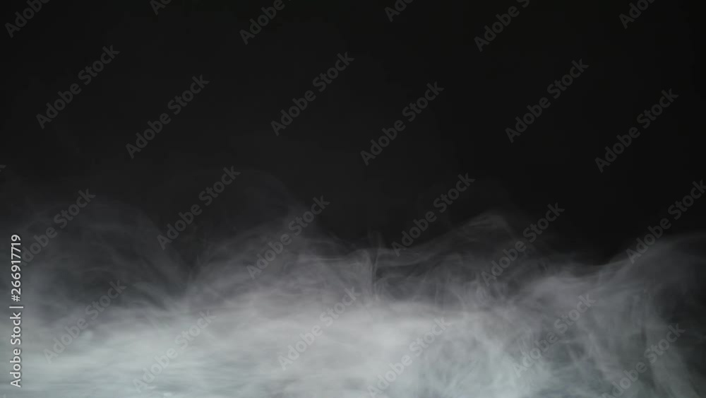Smoke background. Abstract smoke cloud. Smoke in slow motion on black background. White smoke slowly floating through space against black background. Smoke effect. Fog effect. Smoke machine Smoke background. Abstract smoke cloud. Smoke in slow motion on black background. White smoke slowly floating through space against black background. Smoke effect. Fog effect. Smoke machine