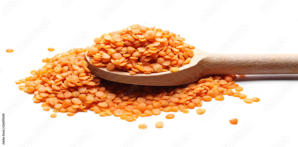 Red lentils with wooden spoon isolated on white background, clipping path Red lentils with wooden spoon isolated on white background, clipping path