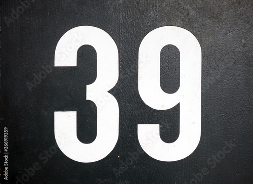 Close up shot of door with numerals 39, number thirty nine photo