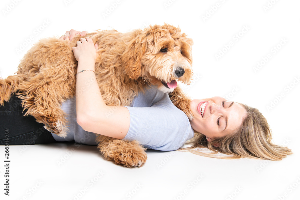 woman with his Golden Labradoodle dog isolated on white background woman with his Golden Labradoodle dog isolated on white background