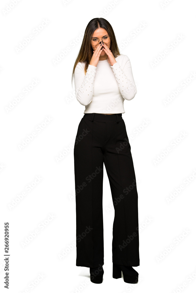 Full body of Pretty woman with glasses smiling a lot while covering mouth Full body of Pretty woman with glasses smiling a lot while covering mouth
