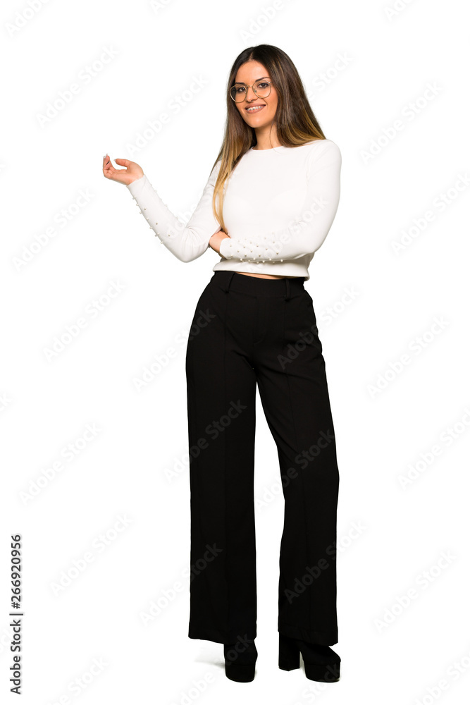 Full body of Pretty woman with glasses pointing finger to the side in lateral position Full body of Pretty woman with glasses pointing finger to the side in lateral position