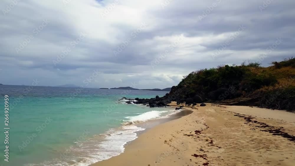 Beautiful tropical Zoni beach loacted in Culebra Puerto Rico. Containing palm trees, clear blue water, and fine sand. Beautiful tropical Zoni beach loacted in Culebra Puerto Rico. Containing palm trees, clear blue water, and fine sand.