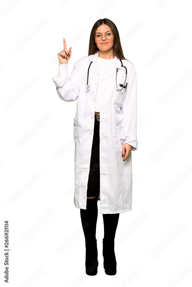 Full body of Young doctor woman showing and lifting a finger in sign of the best