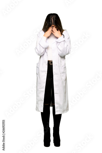 Full body of Young doctor woman with tired and sick expression