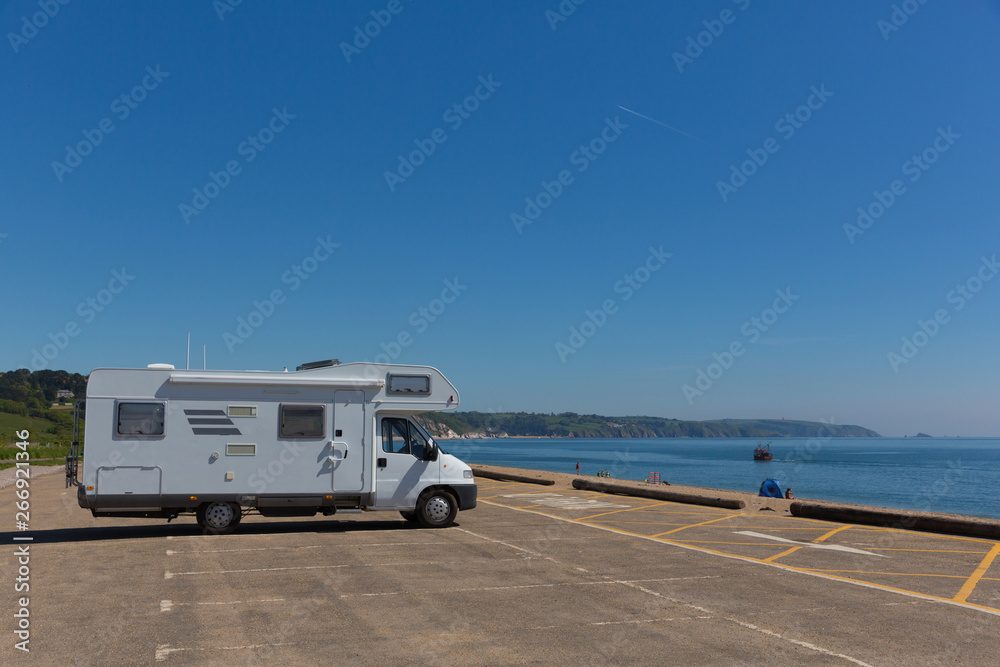 Motorhome parked in car park by the beach Slapton Sands England UK