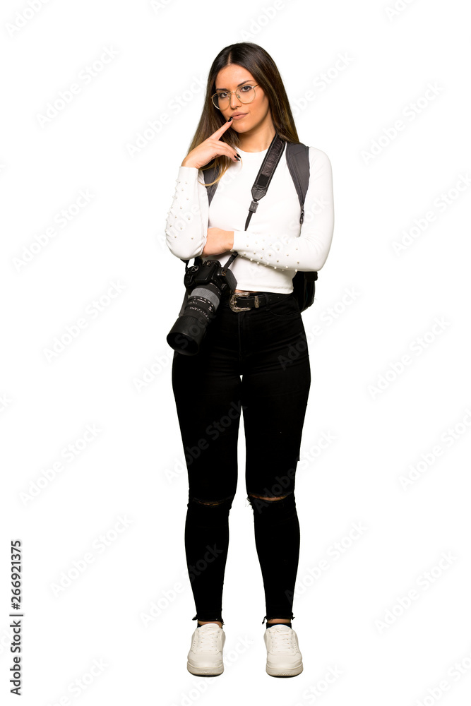 Full body of Young photographer woman having doubts while looking up Full body of Young photographer woman having doubts while looking up