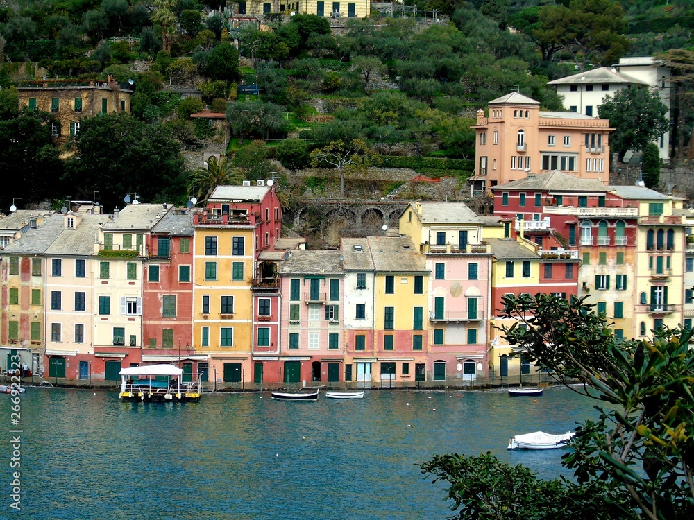 PORTOFINO , ITALY - MAY 02, 2019: The beautiful Portofino with colorful houses and villas, luxury yachts and boats in little bay harbor. Liguria, Italy, Europe