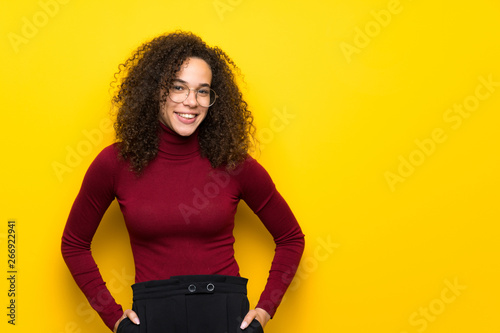Dominican woman with turtleneck sweater With happy expression
