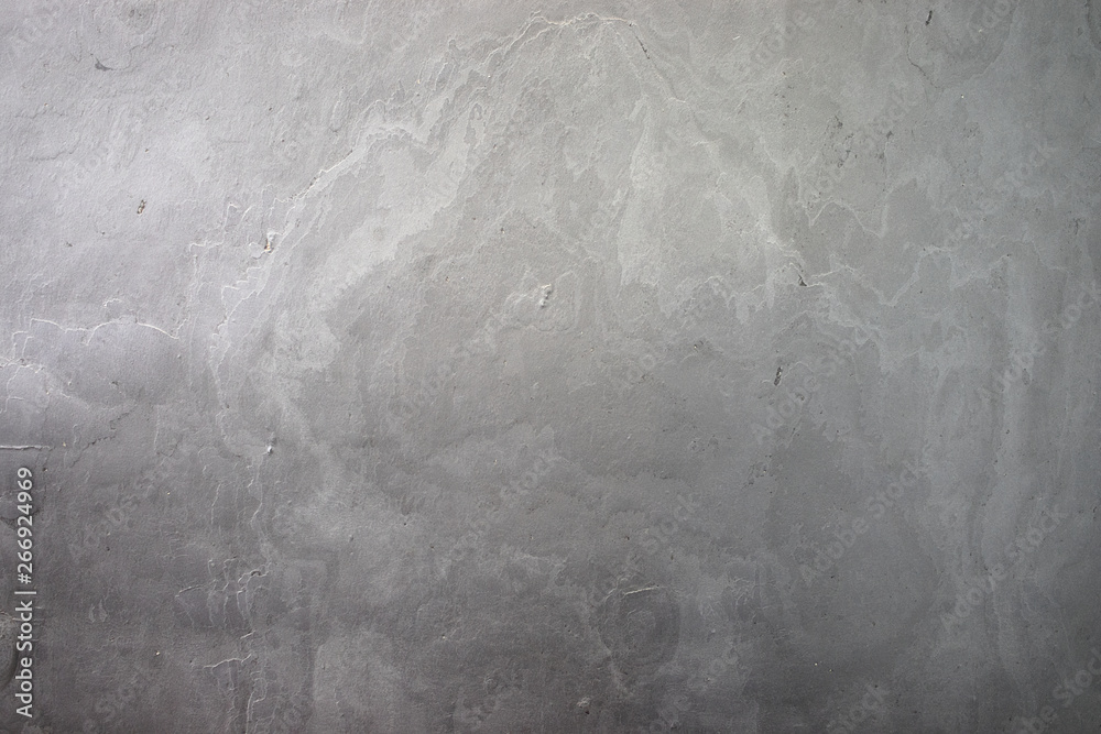 Naklejka premium Natural plaster gray texture. The wall is made of concrete, the surface is textured, gray.
