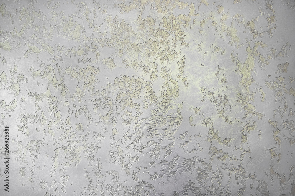 Paper wallpaper with a gold pattern. Yellow drawing on the wall. Paper wallpaper with a gold pattern. Yellow drawing on the wall.