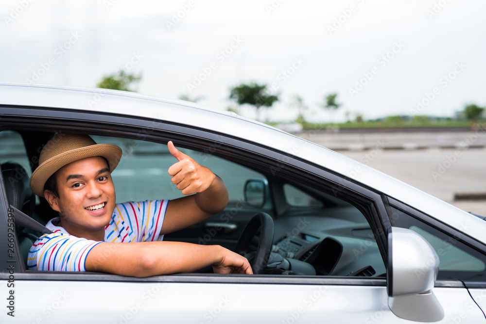 Young asian man driving car. Relaxing, Holiday, Activities, travel, Insurance agent concept.