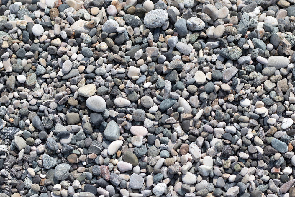 Stone round sea multi-colored. Sea pebbles texture, top view closeup. Stone round sea multi-colored. Sea pebbles texture, top view closeup.