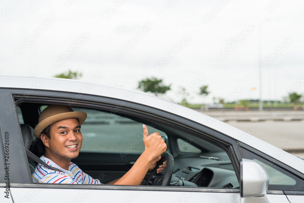 Young asian man driving car. Relaxing, Holiday, Activities, travel, Insurance agent concept.