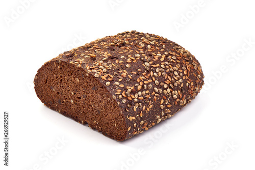 Freshly baked wholemeal rye bread, close-up, isolated on white background