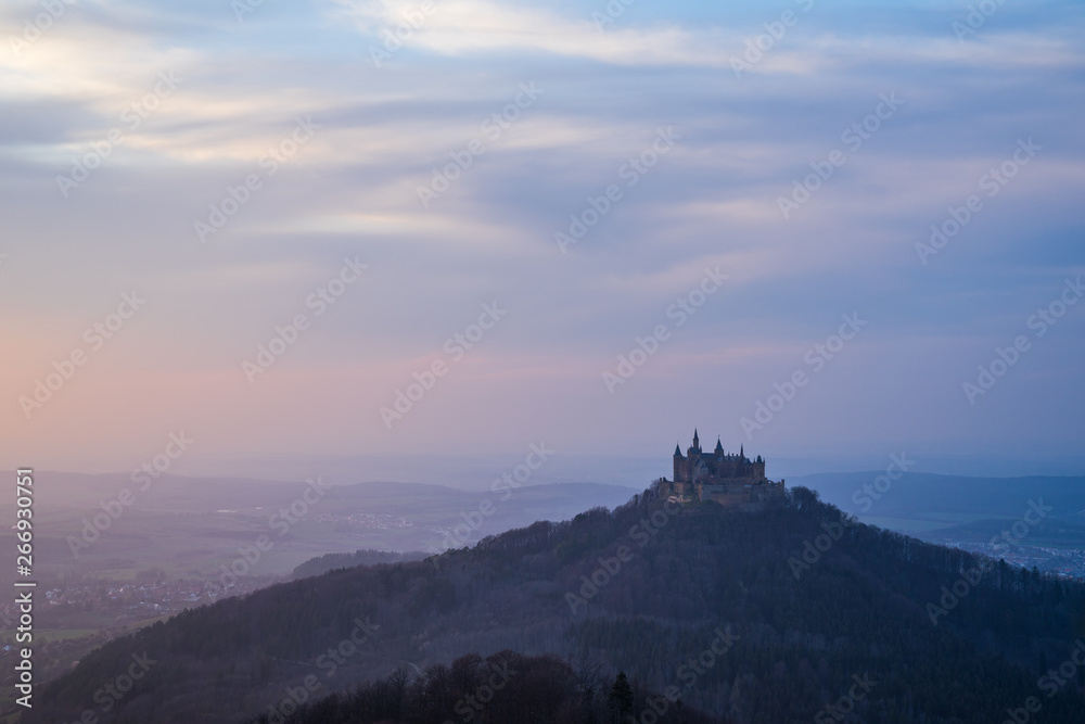 Germany, Hohenzollern castle in misty sunset atmosphere in springtime evening