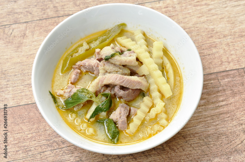 spicy boiled chicken with coconut shoot in curry on bowl spicy boiled chicken with coconut shoot in curry on bowl